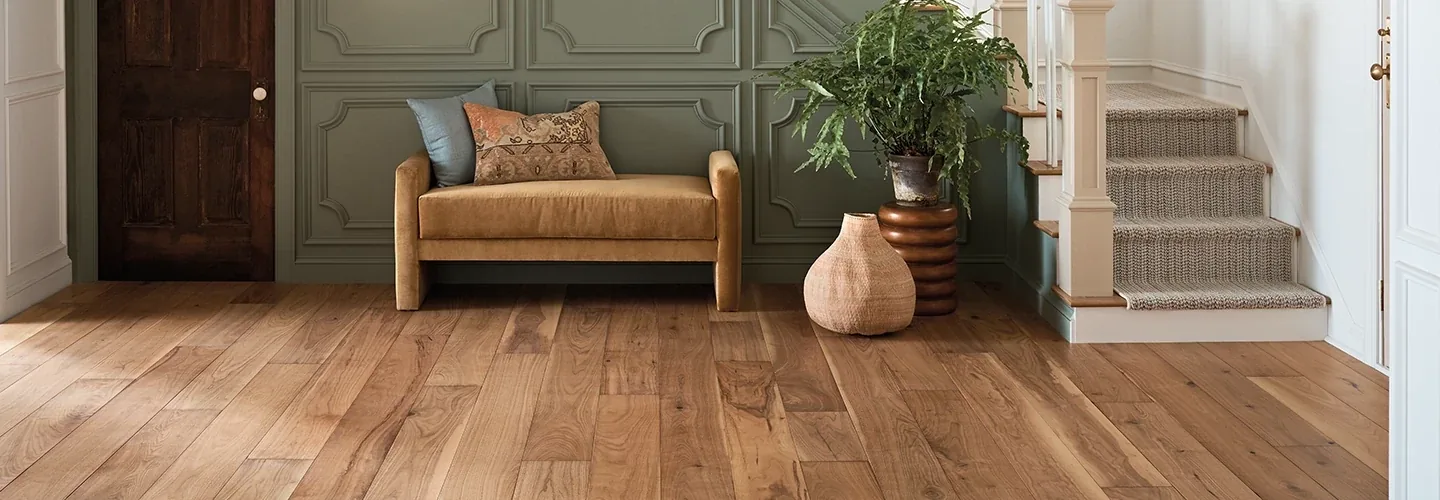 Warm wood flooring selected for a refined mountain-home living space