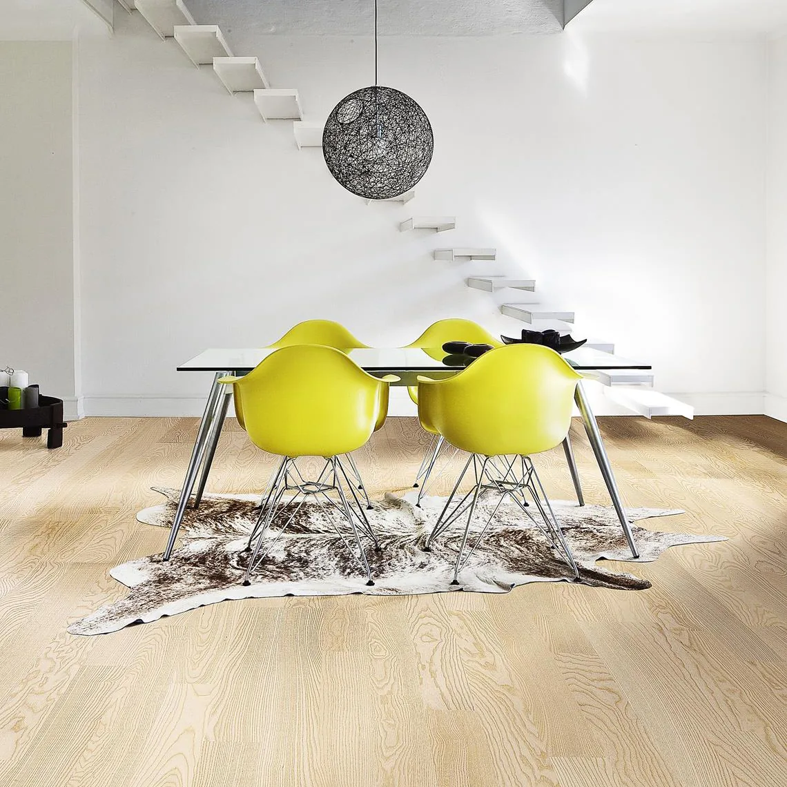 Pale wood flooring in a contemporary dining room